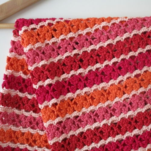 "Simply in red” baby deken