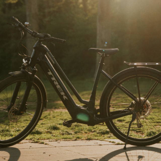 a Trek Allant electric city bike in a park