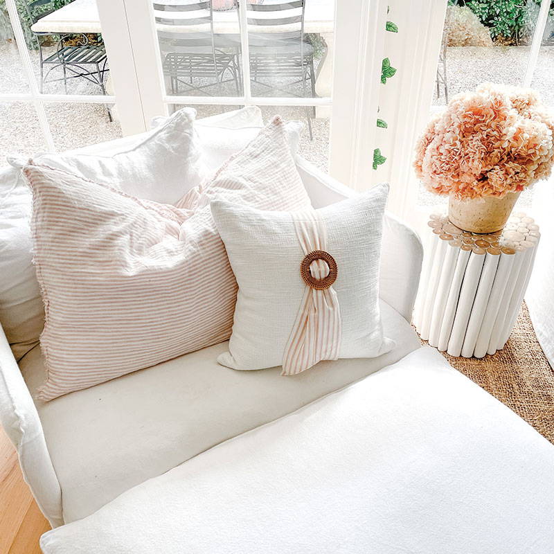 Farmhouse Cushion with Rattan Buckle and Pink/White Stripe Sash - A Charming Accent for Traditional Farmhouse Homes