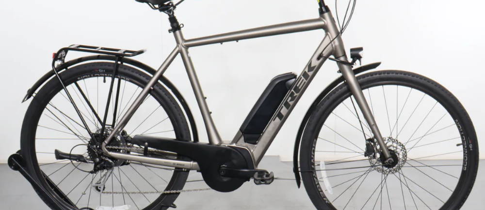 a silver Trek Verve+ 2 electric bike