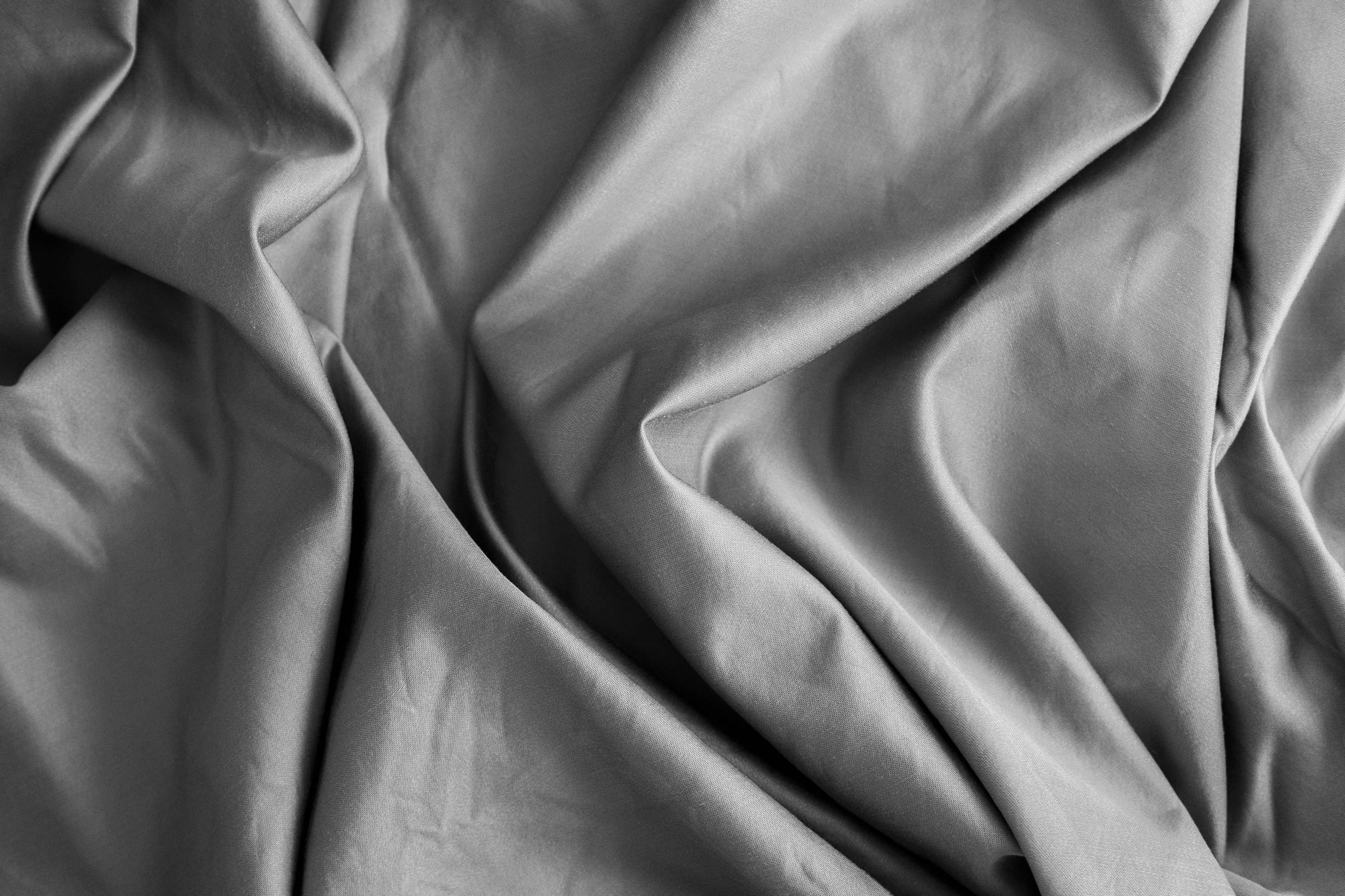 silky bed sheet fabric close up 