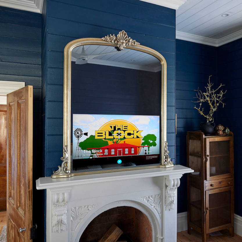 Victorian Arched TV-Mirror in Ornate Soft Silver Leaf Frame - An arched ornate mirror with hidden Samsung TV at the base.