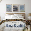a set of three abstract art prints above a bed - blue wall art above bed