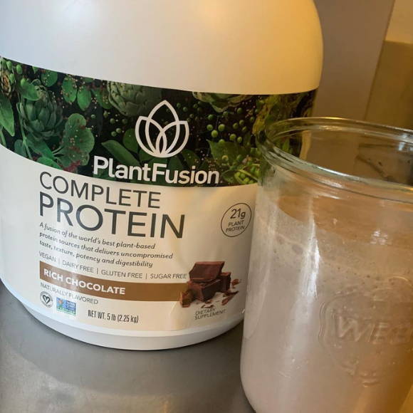 athlete shows his bottle of plantfusion protein