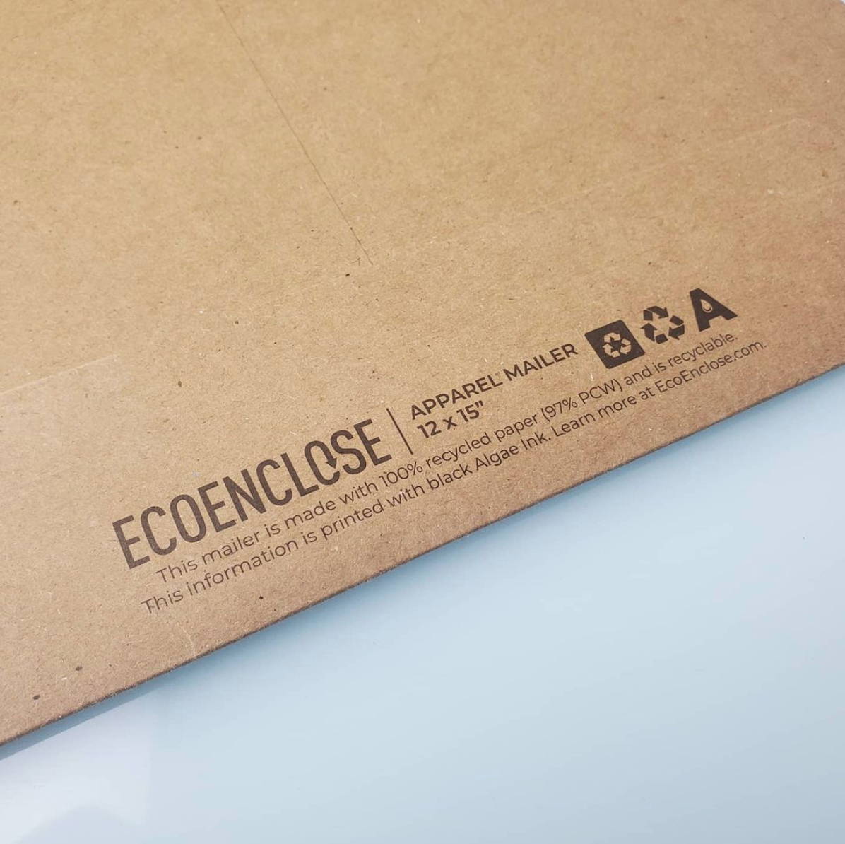 "EcoEnclose apparel mailer 12" x 15". Recycled/recyclable symbols. "This mailer is made with 100% recycled paper (97%PCW) and is recyclable. This information is printed with black Algae ink. Learn more at EcoEnclose.com"