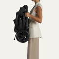 Side view of a folded Redsbaby ONIX pram in Graphite color.