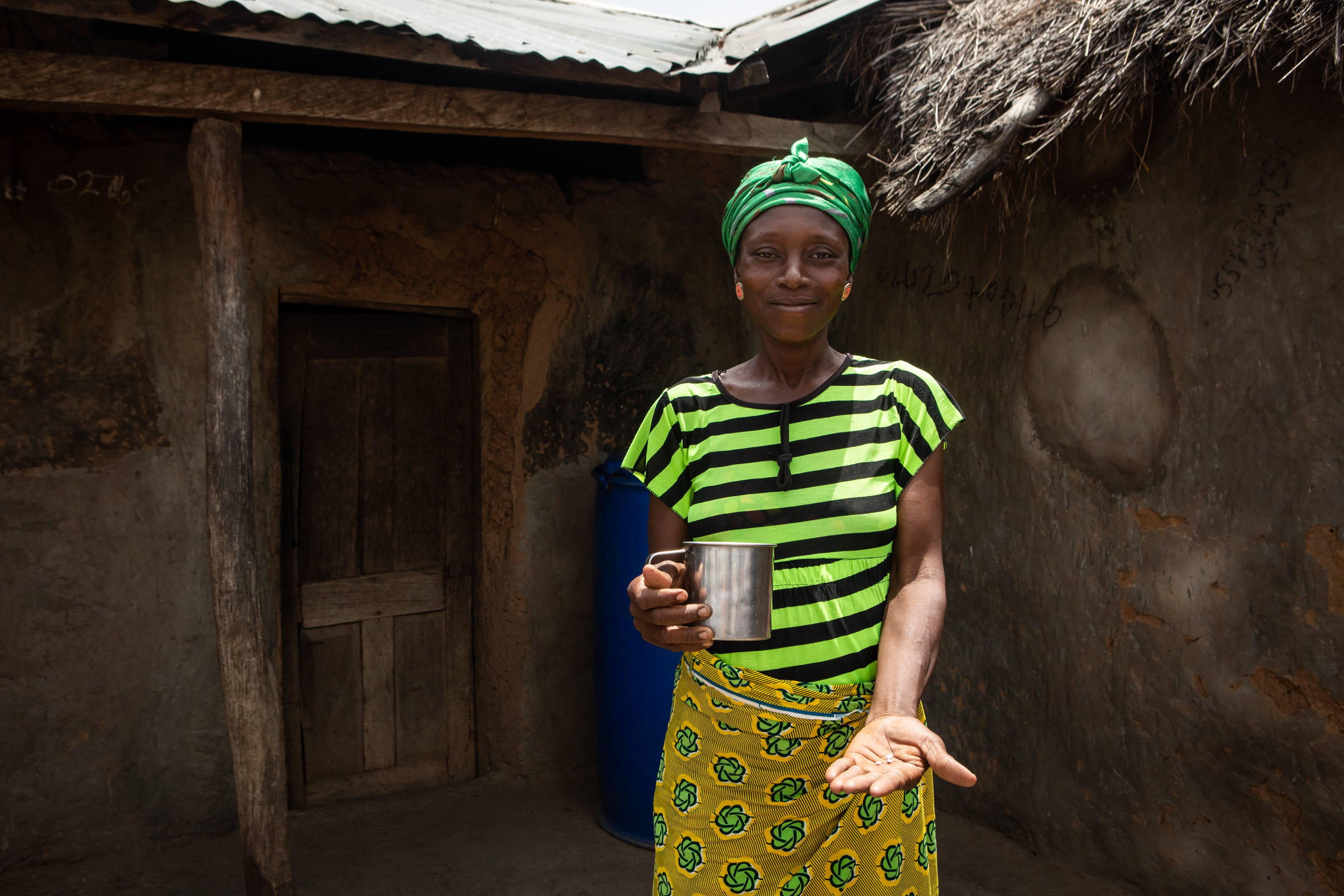 Gmeyenan receives medicine during an MDA in Beposo, Ghana