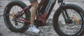 Eshion electric fat tire bike with rider in sand
