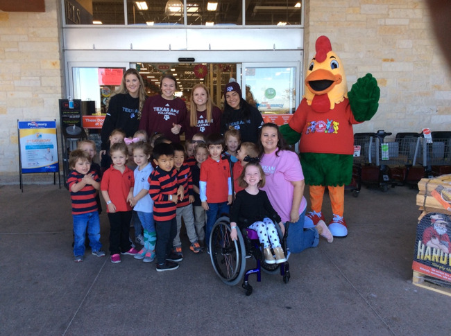 Our Pre-K class out front of HEB with Percy and the A&M Volleyball Team. 