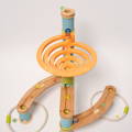 View from on above on glass marbles sliding down bamboo marble run.
