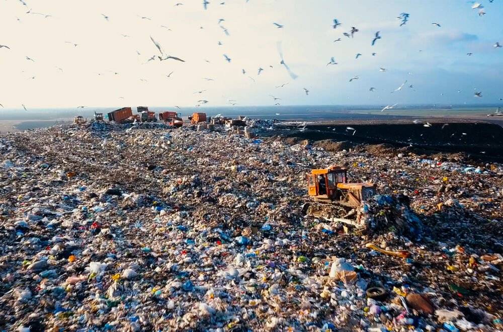 image of a landfill next to the ocean