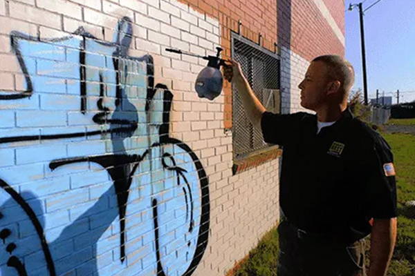removing graffiti from painted brick