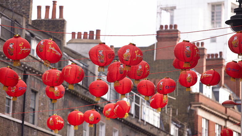 Paper lanterns hanging in the street to celebrate Lunar New Year.