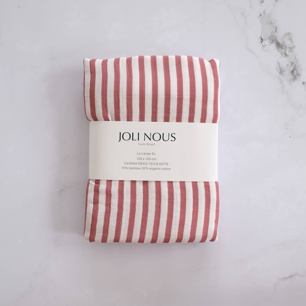 Ring Sling porte-bébé élégant de la marque suisse Joli Nous, un accessoire premium pour bébé, alliant design raffiné et qualité exceptionnelle