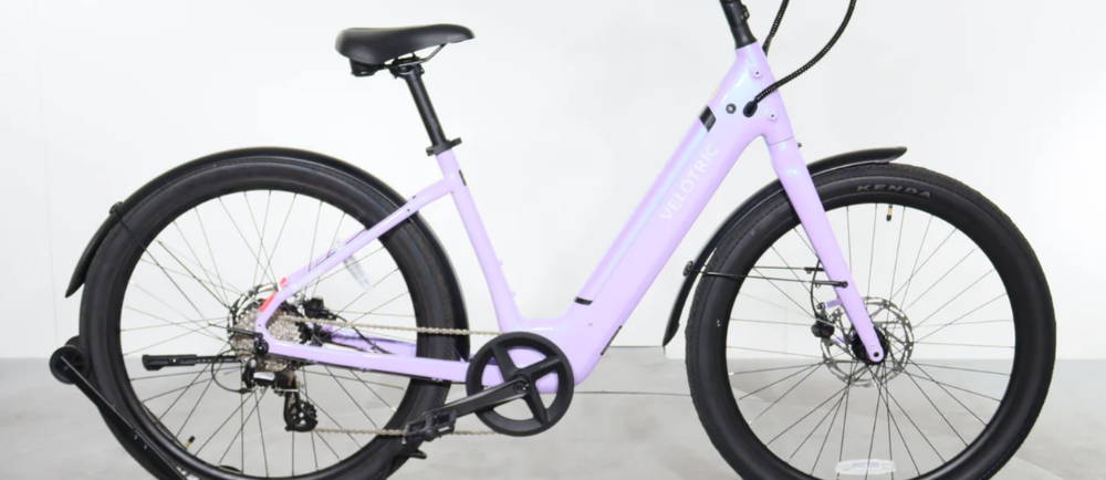 a purple Velotric Breeze 1 electric city bike