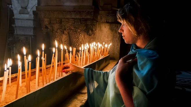 The pilgrims lit candles at the Church of the Holy Sepulchre in Jerusalem, Israel