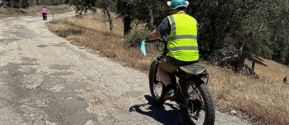 a man and a woman climbing a hill on aventon aventure electric bikes during a tour with Yosemite E-Biking (yosemiteebiking.com)