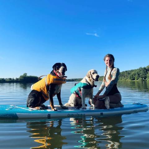 Customer with her dogs on Funwater best blow up paddle board