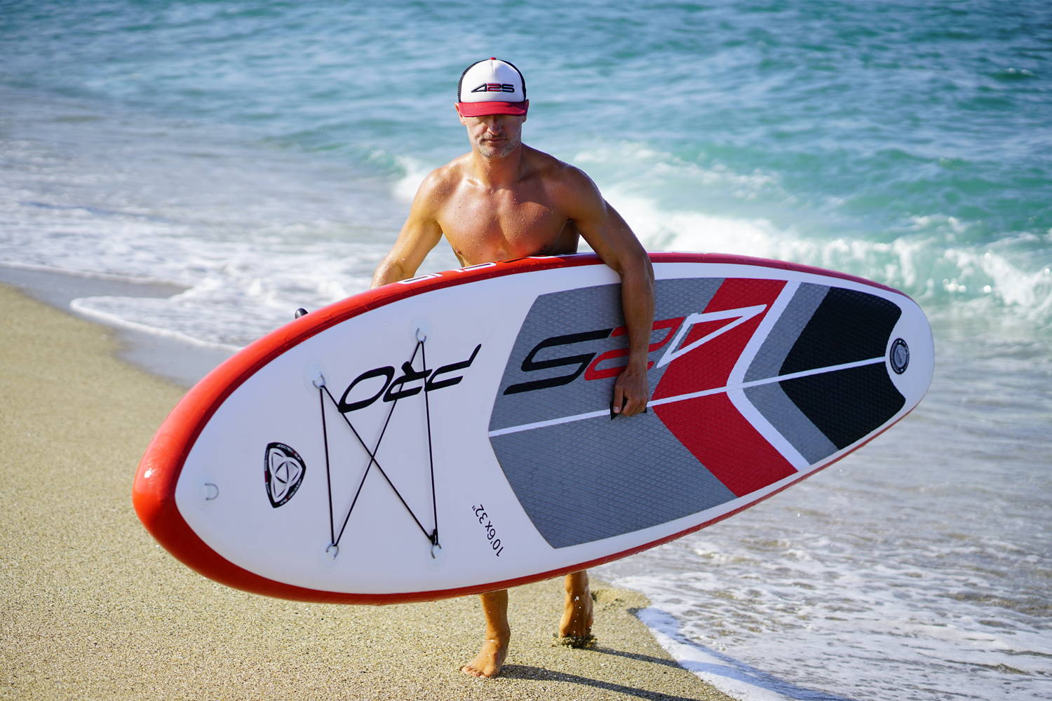 425pro Air SUP all round board: A man carrying the board out of water