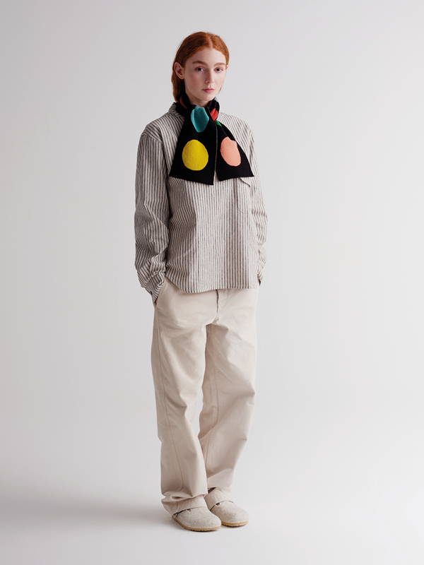 model wears small multicolour spot scarf black