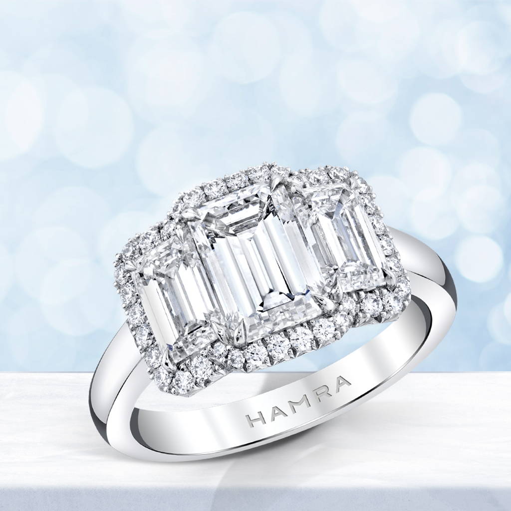 three stone emerald cut diamond ring in platinum