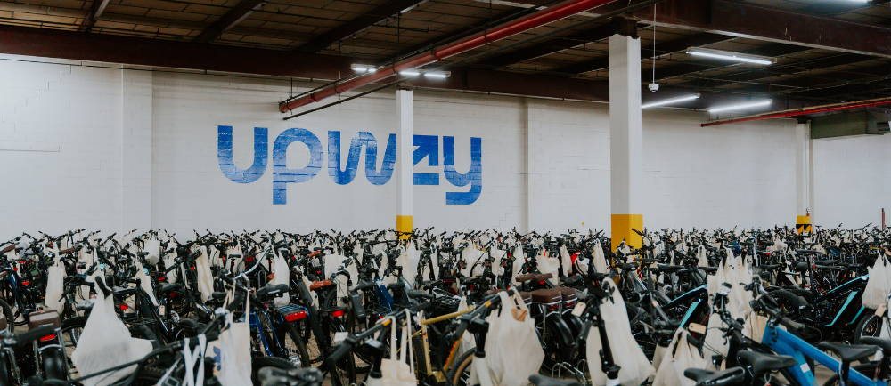 the Upway warehouse with a big group of bikes