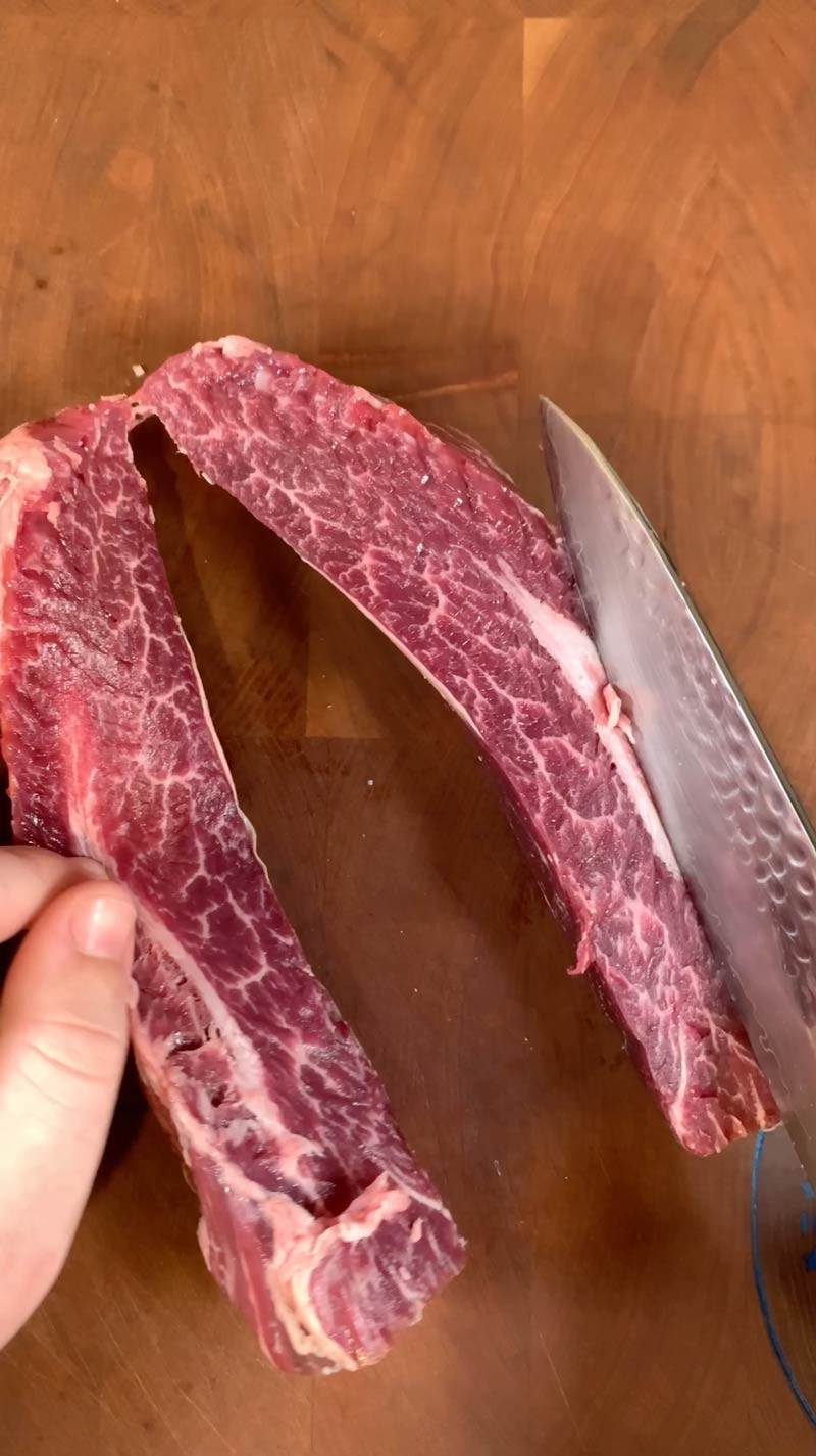A home chef separates a Certified ONYA hanger steak from BetterFed Beef in order to remove the silver skin membrane and make the steak even more tender. 