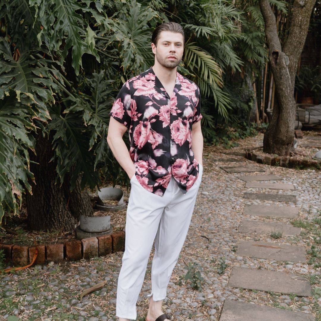 model standing in the garden wearing a black and pink short sleeve silk shirt from 1000 kingdoms