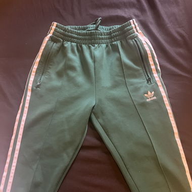 Green adidas three stipe pants