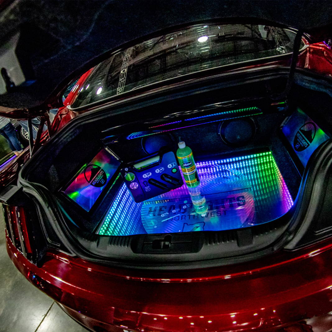 Slime Flat Tire Repair Kit in Trunk at Car Show