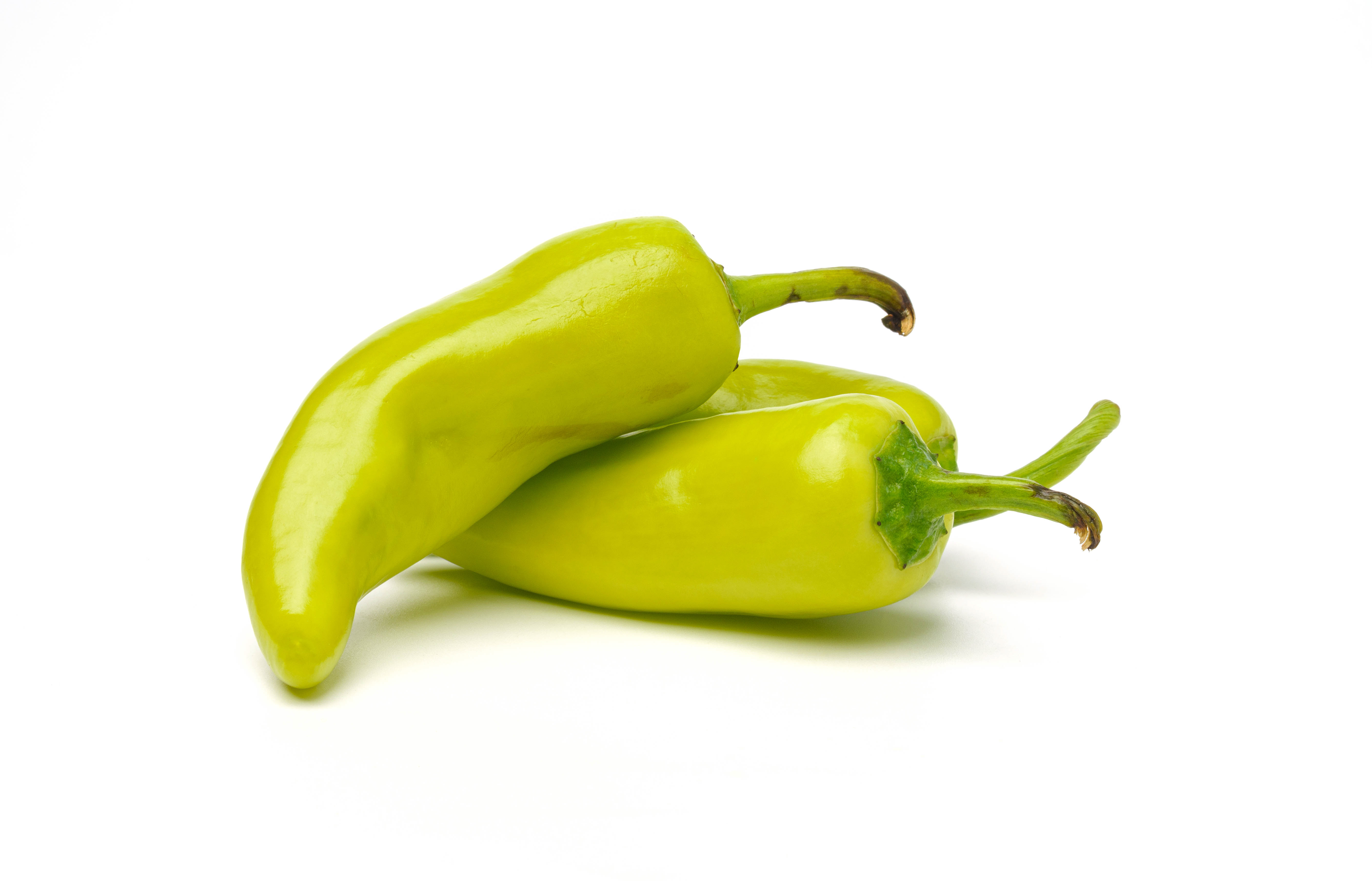 Light green peppers on a white background