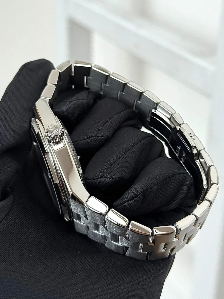 Leather strap included