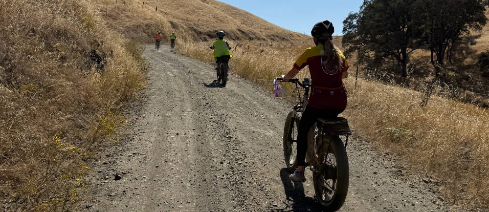 four riders climbing a hill on aventon aventure electric bikes during a tour with Yosemite E-Biking (yosemiteebiking.com)