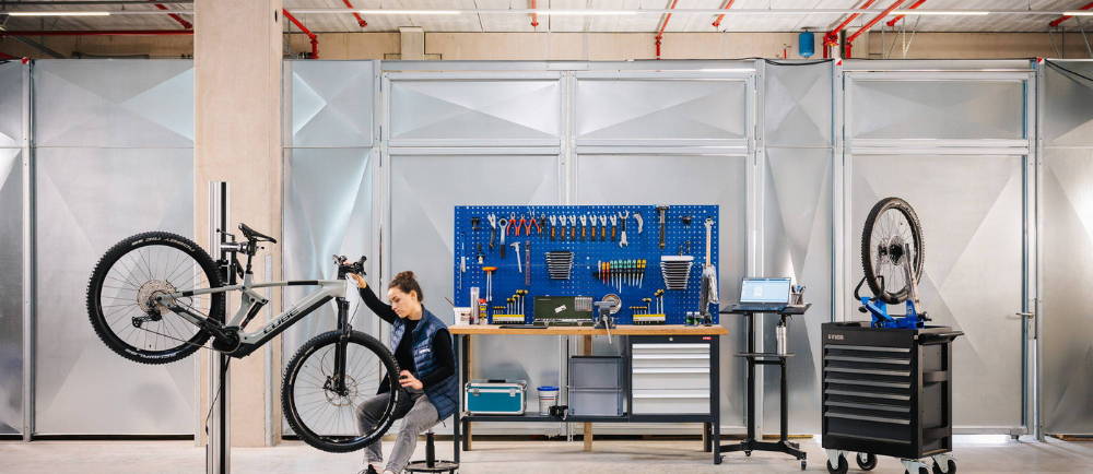 Upway technician and bike in workstand