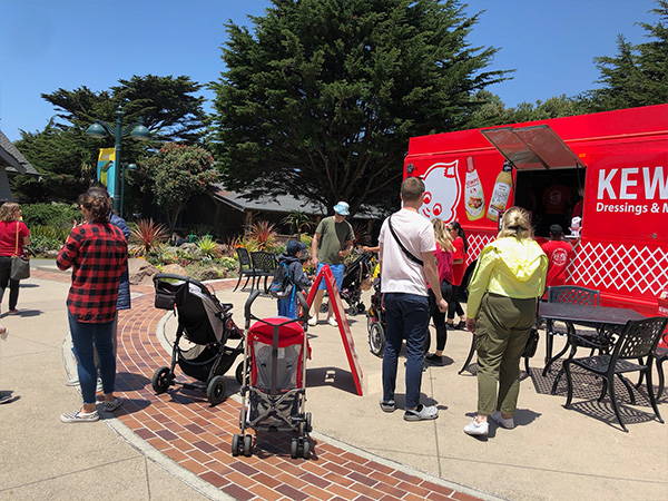 Families lining up at the food truck