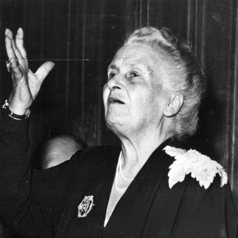 Dr. Maria Montessori giving a speech.