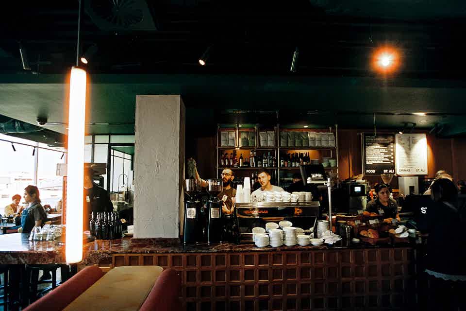 cafe interior with baristas working