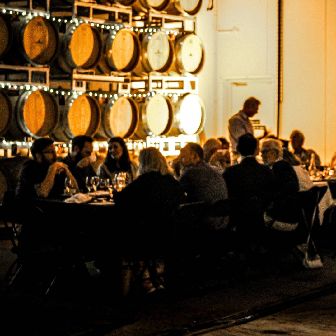 Two people with wine outside enjoying a Sunset Session