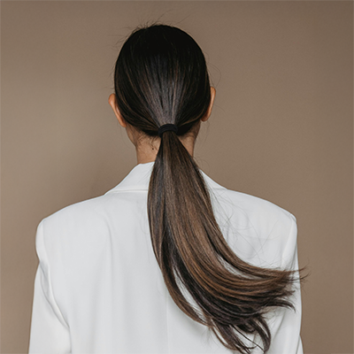 model with a low ponytail