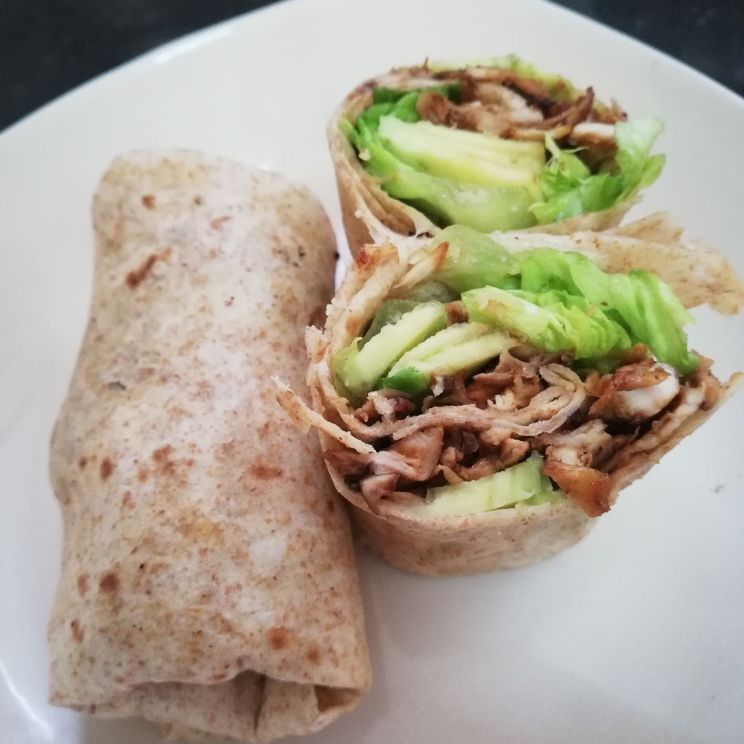 Stir-fried chicken with avocado and lettuce wraps for breakfast