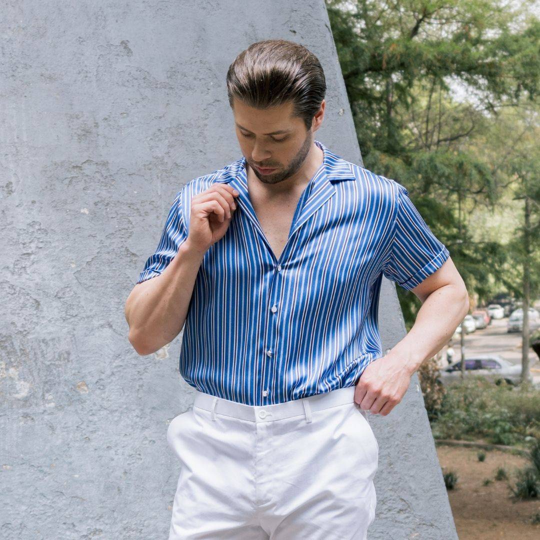close up photo of a short sleeve blue stripe silk shirt from 1000 kingdoms being worn by a model
