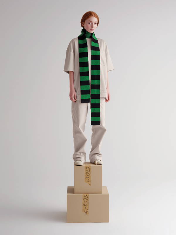 model wears Long Bold Stripe Garter Stitch Scarf Black & Pagoda