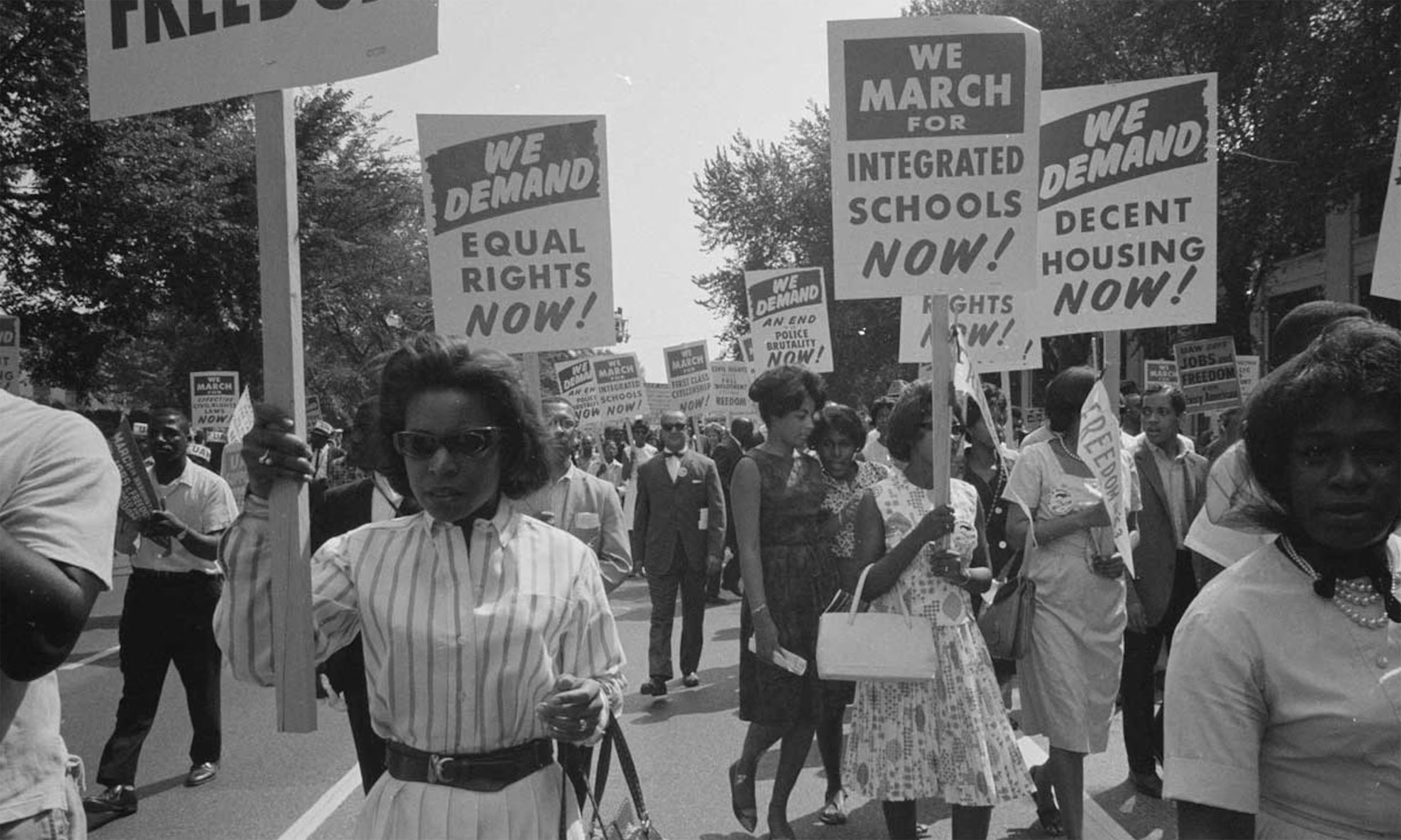 Black individuals marching for equal rights and integrated schools, an important moment in black history
