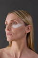 woman with a dry dehydrated skin and face cream