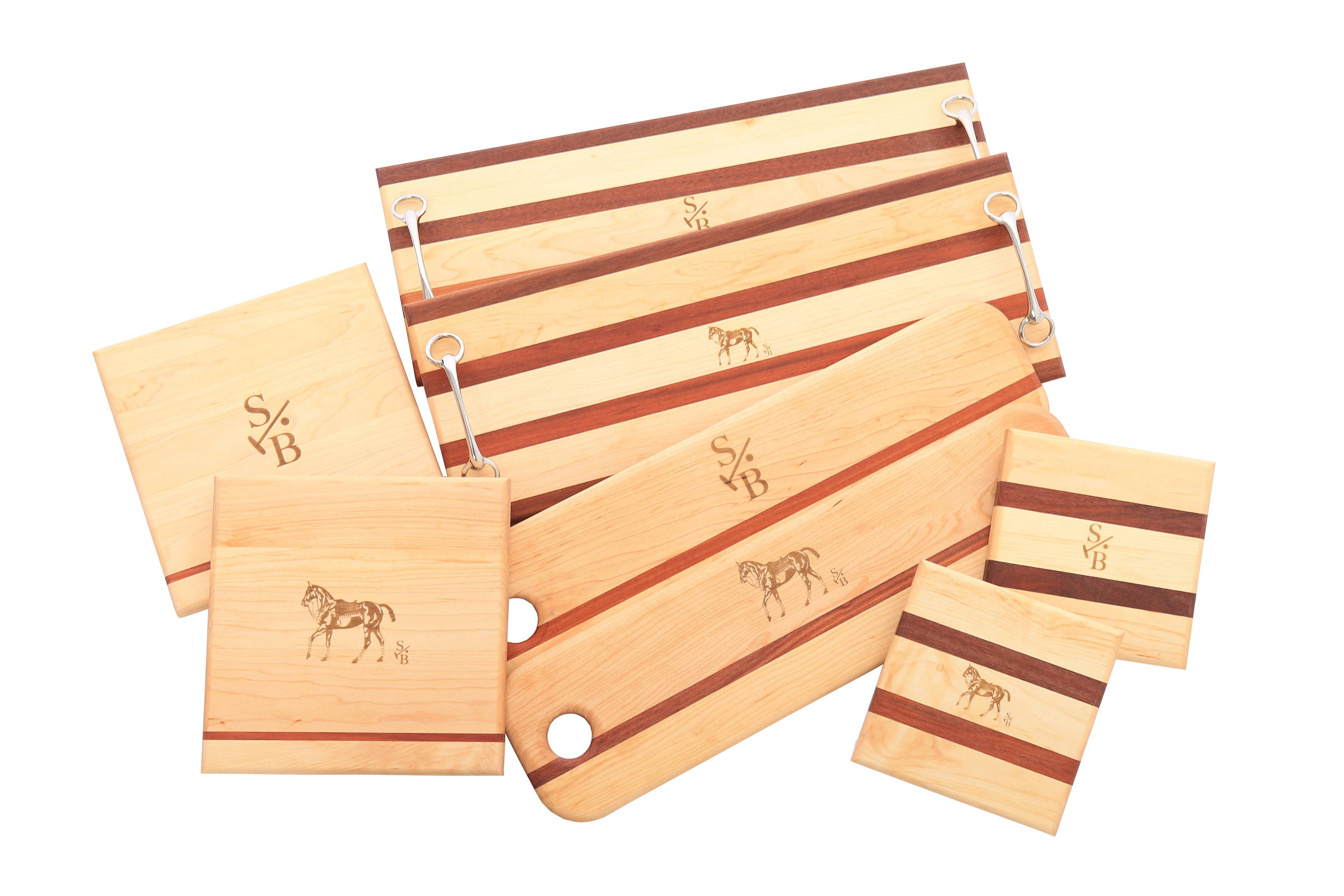 Display of rustic wooden serving boards, french bread boards & cheese blocks with Stick & Ball Logo & Polo Pony 