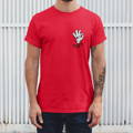 Model showing the fit and material of Mongolife's "Cartoon Hand Joint - T-Shirt" in the red variant. Tattooed man standing against an industrial backdrop.