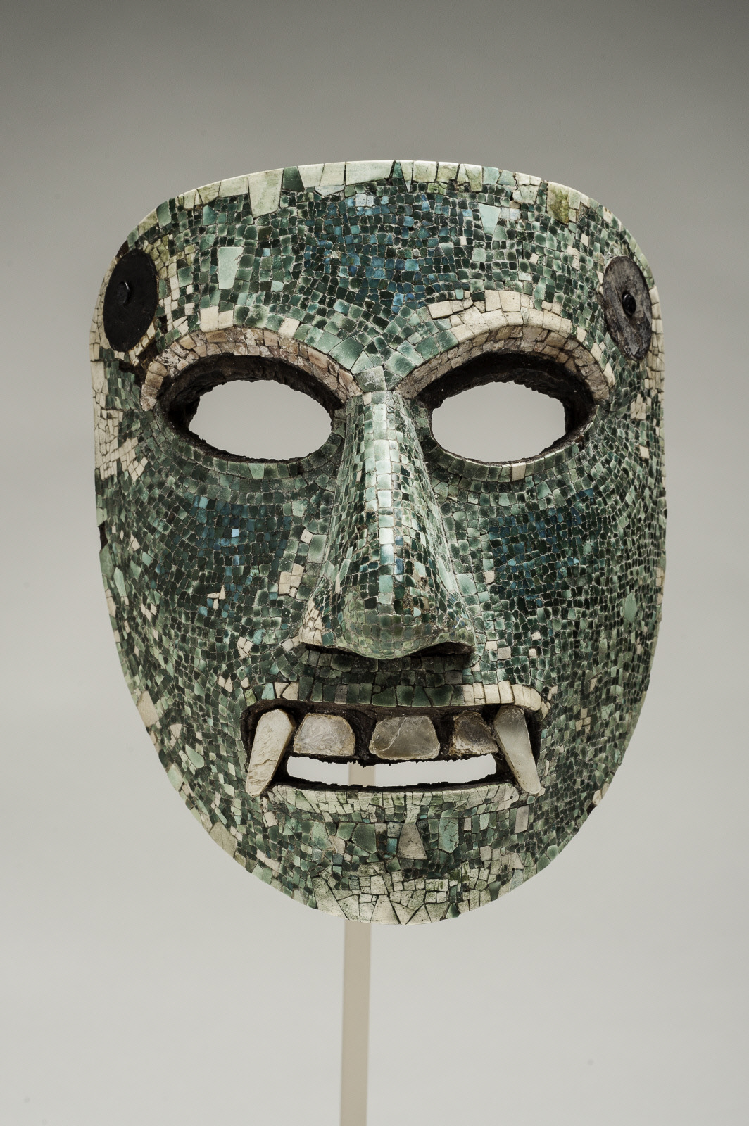 Image:  Mask  Mixtec, 1321-1421 CE  Wood, turquoise, and mother-of-pearl  h. 6 in. (15.2 cm); w. 5 in. (12.7 cm); d. 3 1/2 in. (8.9 cm)  Bequest of Elizabeth Huth Coates, 97.1.18