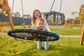 Kid on a balance swing