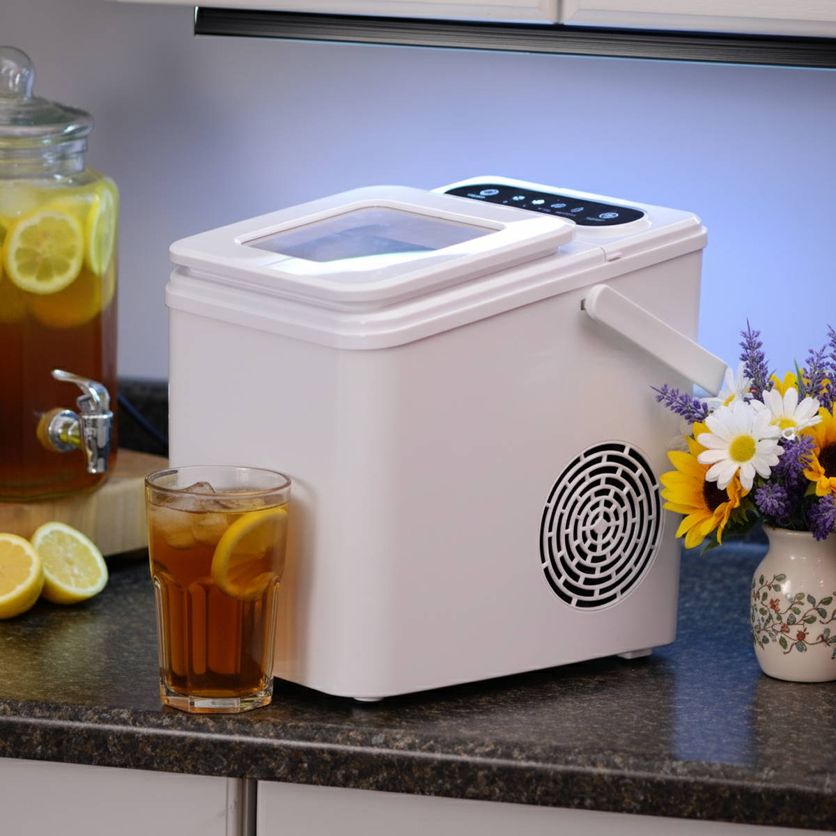 White EdenPURE UV IcePRO countertop ice maker producing fresh, clean bullet ice.