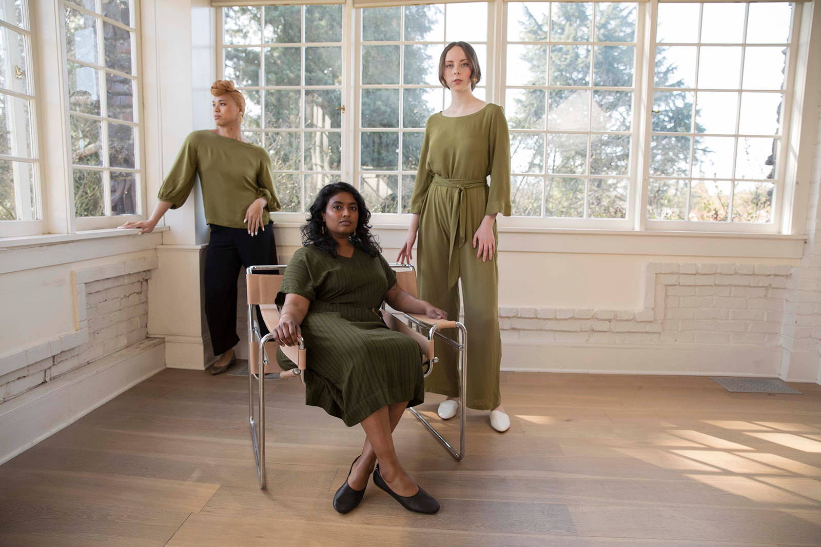 Models wearing the zero waste Hanae collection in moss green